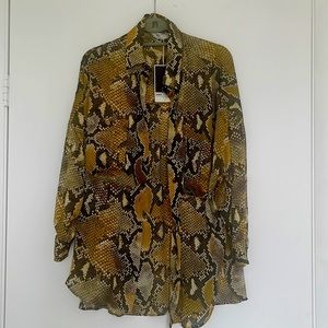 Brand new chic blouse. Silk like polyester.